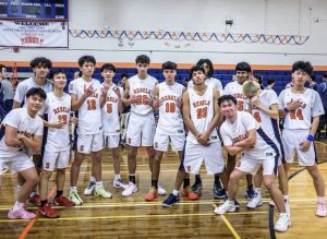Rebels Triumph Over Rivals in Statement Victory—Senior captain Jesse Roggendorf celebrates the milestone of scoring 1,000 points after beating cross-town rival Great Neck North.
Photo by Mateo Guevara

